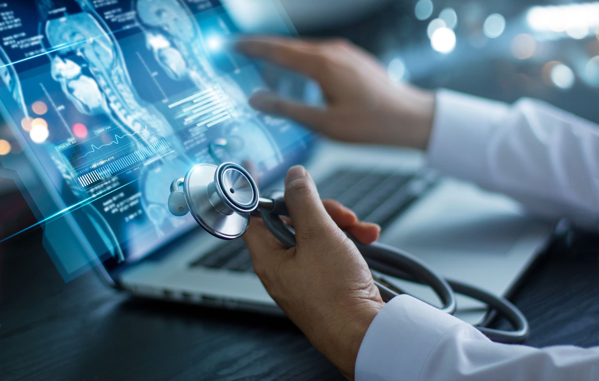Doctor holding a stethoscope in front of a laptop displaying AI medical data